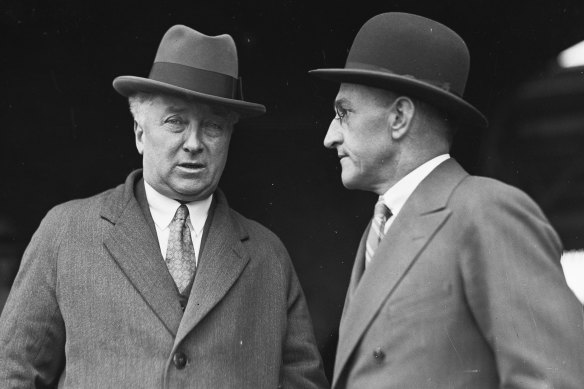 "We must avoid becoming insular": Prime Minister Joseph Lyons (left) pictured on his return from the UK on August 12, 1935.