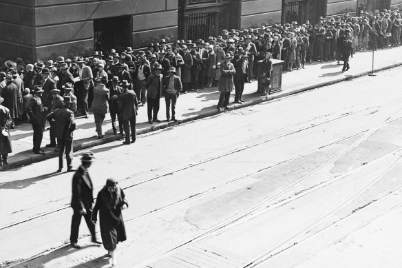 With the State Savings Bank collapsing, customers queue to apply as necessitous depositors at the Commonwealth Bank on the corner of Castlereagh Street and Martin Place, Sydney, 1931