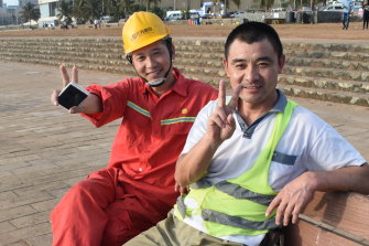 Chinese construction workers relax at the Galle Face Green, near the Port City Colombo reclamation site.