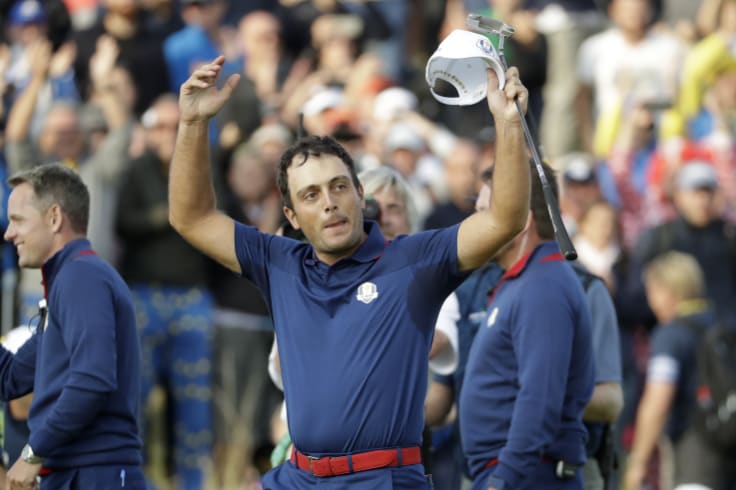 Riding high: Francesco Molinari celebrates a win in the Ryder Cup.