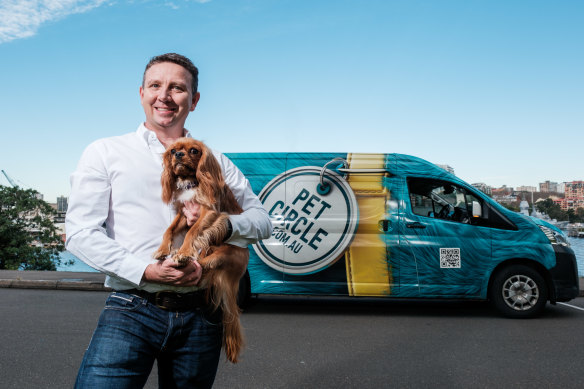 Pet Circle CEO Mike Frizell, with King Charles cavalier Chewie, has 140 vans delivering orders for the online-only pet business.