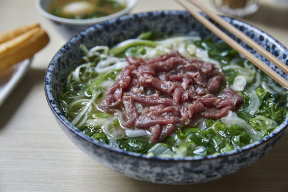 Rare beef noodle soup with fried dough stick bread and onsen egg.