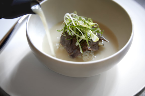 Guk-bap (rice soup) with beef shin and pickles.