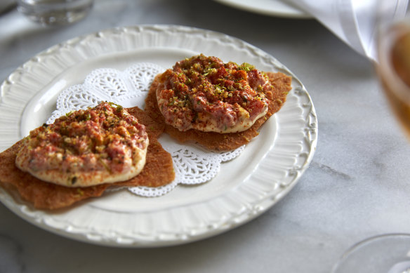 Wagyu tartare, blood lime and   macadamia cream on pane carasau.