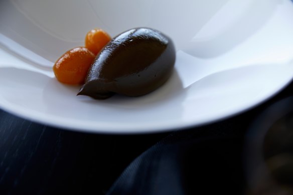 Chocolate ganache and poached cumquats.