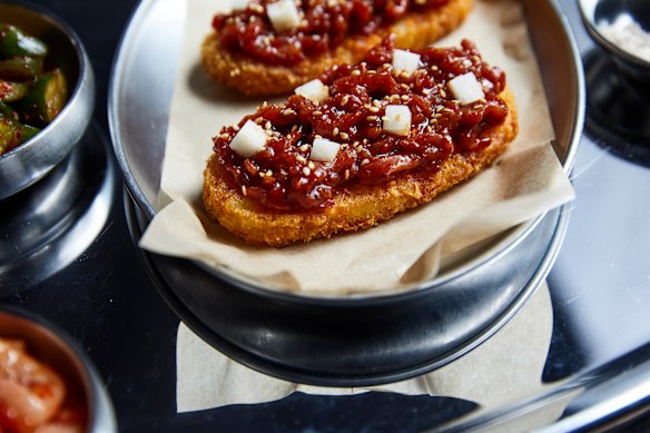 Korean beef tartare on hashbrowns.