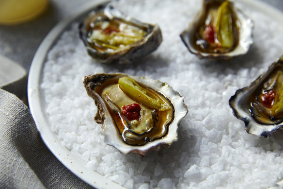 Beef fat-dripped flambadou oysters with ’nduja and guindilla at Poetica, North Sydney.