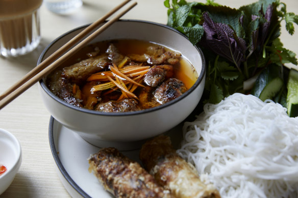 Bun cha set with chargrilled pork and meat balls and spring rolls.