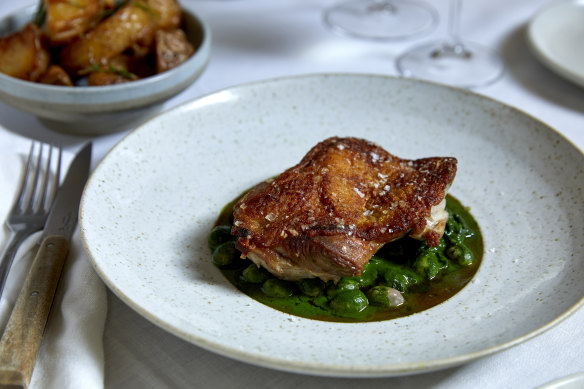 Go-to dish: Sommerlad chicken with borlotti beans and cavolo nero (and a side of wood-oven roasted potatoes, top left).