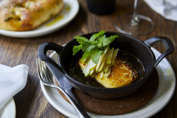 Go-to dish: Wood-baked halloumi with pear and Malfroy’s Gold honey (plus optional rosemary flatbread, top left).