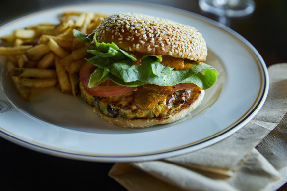 Dry-aged beef burger with lettuce, tomato and cheese.