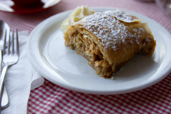 House-made apple strudel with whipped cream.