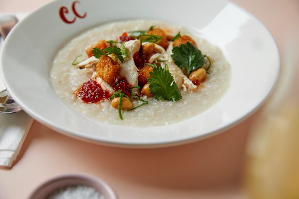 Congee with shredded roast chicken, peanuts, chilli and fried bread.