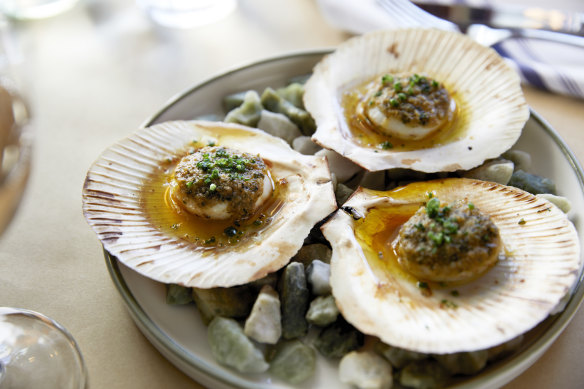 Go-to dish: Grilled scallops gratineed with Cafe de Paris butter.