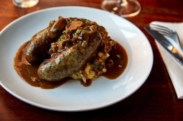 Bangers and mash (pork and fennel sausages with colcannon, caramelised onions and red wine sauce).