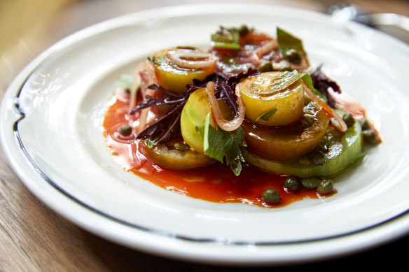 Ferrari-red oxhearts with pickled onion and lovage. 