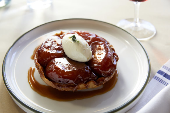 Tarte tatin crowned with creme fraiche.