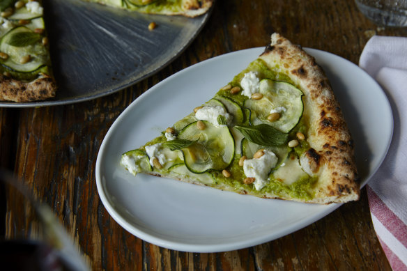 Queen Envy pizza topped with mint, zucchini, feta and pea puree