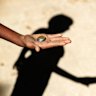 Giving money to child beggars in the developing world perpetuates a cruel system.