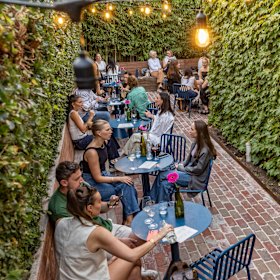 Gracie’s lush courtyard is popular on weekends.