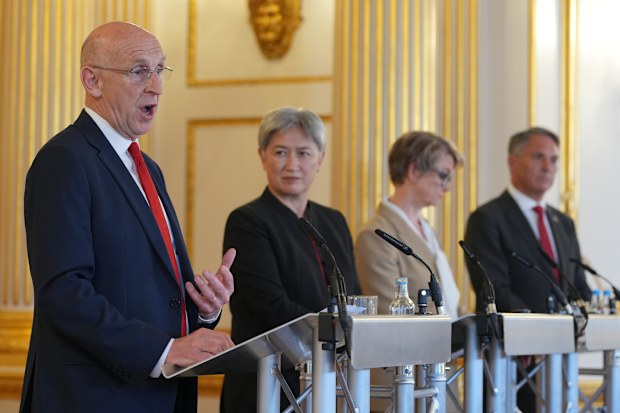 Britain's Defence Secretary, John Healy, left speaks, during a press conference following the AUKMIN Summit