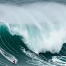 No chance: Maya Gabeira from Brazil, rides a wave during the Nazare Big Wave Challenge surfing tournament at Praia do Norte in Nazare, Portugal. Walsh headed further afield to find his wave to surf.