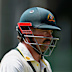 Australia’s Travis Head walks back to the pavilion after his dismissal on day five.
