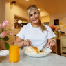 Olivia Patterson enjoys Bill’s signature Ricotta Hotcakes with honeycomb butter and maple syrup.