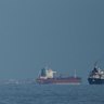 Oil tankers and cargo ships lining up in the Strait of Hormuz. What if it stays closed?
