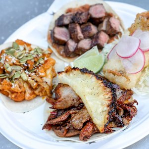 Clockwise from left: Cauliflower, steak, fish and al pastor (pork and pineapple) tacos from Super Taco.
