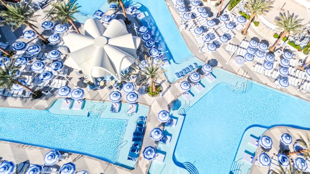 By day, interlocking pools, cabanas and daybeds are sought-after spots for relaxation.
