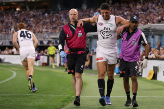 Marc Pittonet of the Blues is assisted to the rooms. 