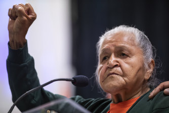 Kamloops Indian Residential School survivor Evelyn Camille, 82, raises her fist as she speaks about her experience at the school.