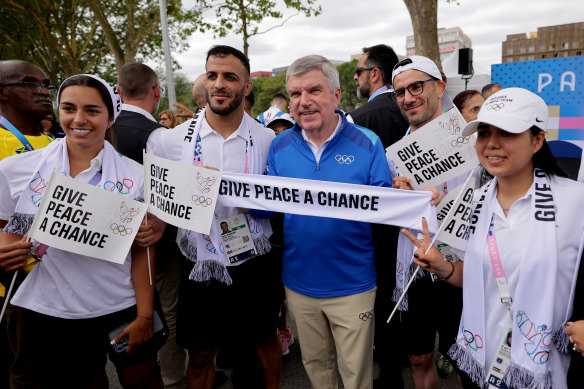 IOC president Thomas Bach and members of the Refugee Olympic Team during the Athletes’ Call for Peace event on Monday.
