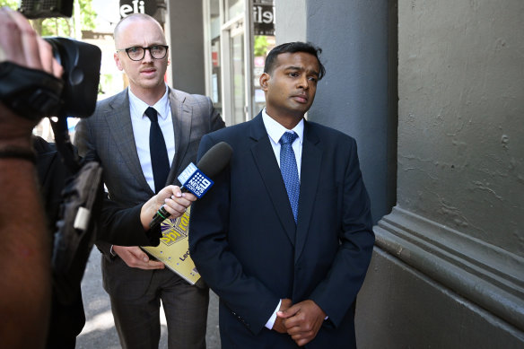 David Maria Anthony Rayan (right) leaves Melbourne Magistrates’ Court on Friday.