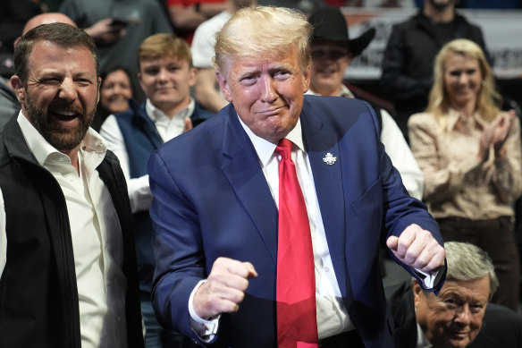 Putting up a fight: Donald Trump at the NCAA Wrestling Championships,  in Tulsa, Oklahoma last weekend.