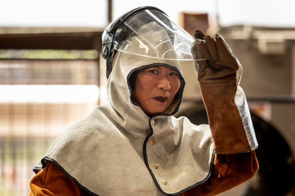 Lindy Lee working on her flung bronze works at the Foundry in Brisbane.