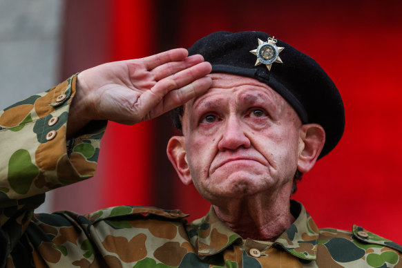 Lance Corporal Arthur Davis salutes on the steps of the Shrine of Remembrance. 