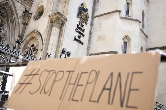 A placard left outside the High Court in London.