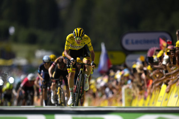 Race leader Tadej Pogacar crosses the line in Megeve.