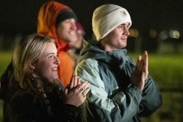 Spectators watch on a big screen at Cornwall Airport Newquay as the LauncherOne rocket is launched from Cosmic Girl, in Newquay, United Kingdom. 