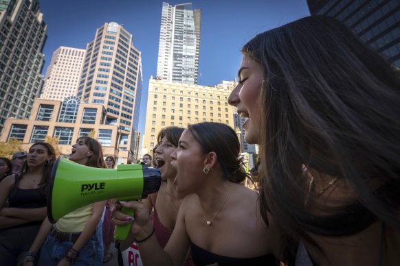 People chant into a megaphone during the Global Climate Strike protest in Vancouver, British Columbia.