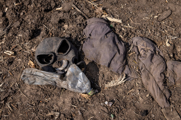 A gas mask is seen on the ground next to a destroyed Russian tank on March 31, 2022 in Malaya Rohan, Ukraine.