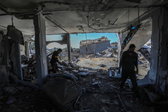 Residents of Gaza in a home in Khan Younis that was hit by Israeli airstrikes before the temporary ceasefire.