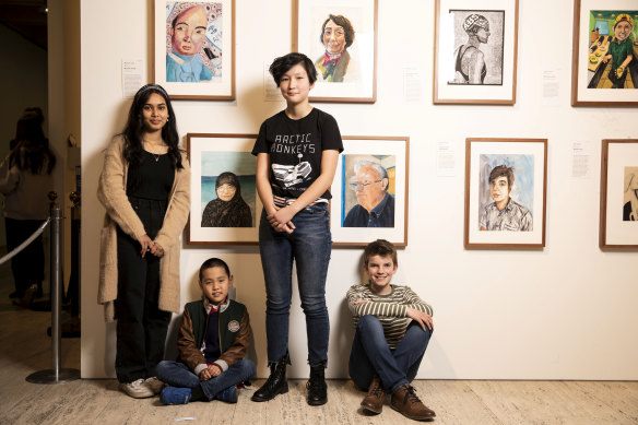 Winners of the Young Archie competition: Aysha Huq, 16; Matthew Chen, 8; Celeste Hang, 15; and Callum MacGown, 11, in front of their winning portraits at the Art Gallery of NSW.