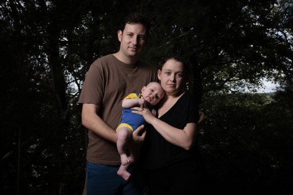 Adam and Naomi McGowen with their son Austin, in February last year. 