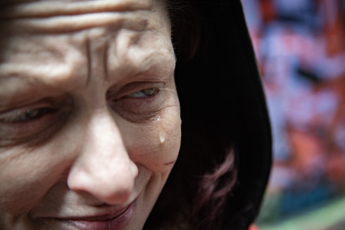 A woman, who is homeless and uses drugs, in Hosier Lane.