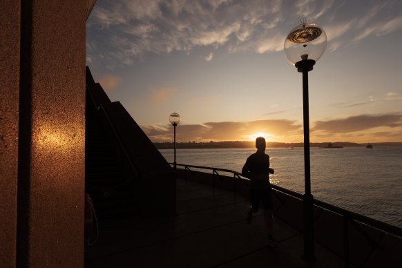 The sun rises over Sydney’s harbour on the winter solstice on Tuesday.