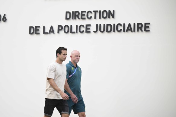 Tom Craig leaving police custody in Paris with Hockey Australia’s high performance manager Bernard Savage.