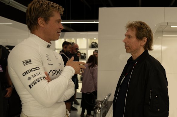 Brad Pitt and Jerry Bruckheimer on the set of F1.